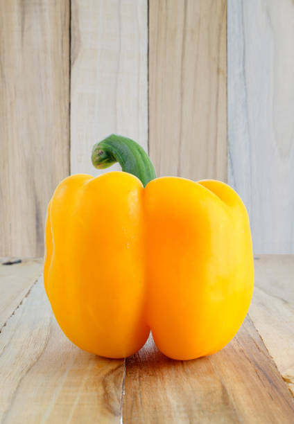 istock yellow bell pepper on wooden 650731952