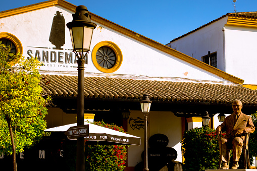 JEREZ, SPAIN - AUGUST 12, 2014: World famous bodega. The wine company Sandeman is founded in 1790. Entrance to bodega.