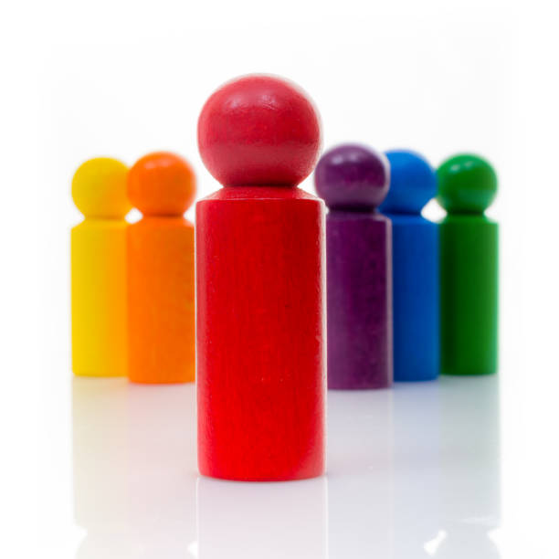 istock Red leader Pawn with it's team in rainbow colors 650776080
