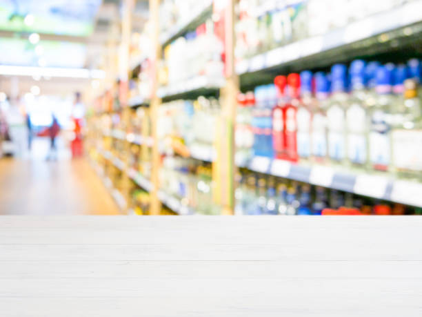 istock White wooden empty table in front of blurred supermarket 650804212