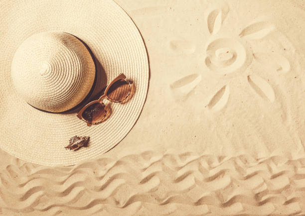 istock Summer hat put on the tropical sand beach 650819234