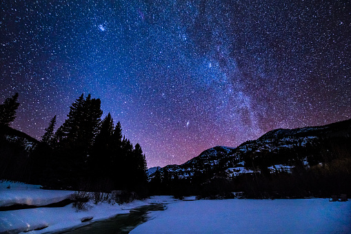 Creek and Mountains Milky Way Galaxy - Astrophotography of scenic night landscape in mountains.