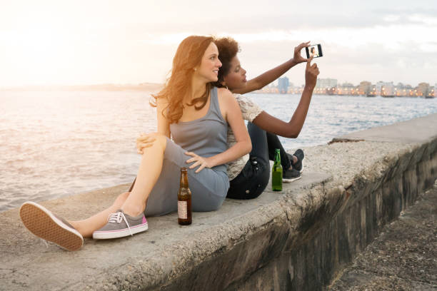 istock friends taking selfie, Malecon, Havana, Cuba 650851496