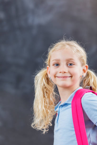 istock Portrait of beautiful elementary schoolgirl 650855230