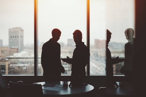 istock Two young businessman on private meeting 650858932