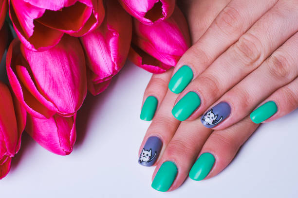 istock Nail art in turquoise with white cat on grey 650934856