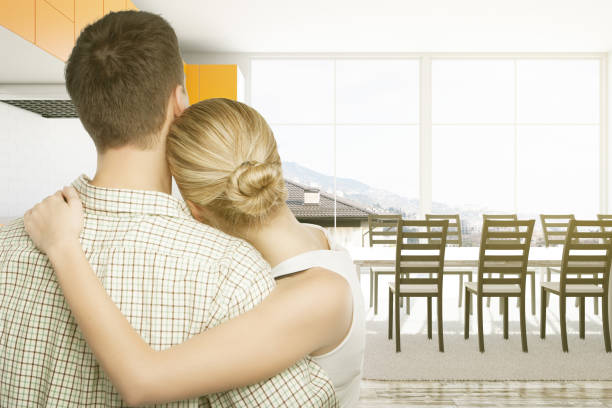 istock woman and man standing in kitchen 650936560