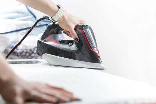 istock Woman uses irons, ironing at home. 650966320