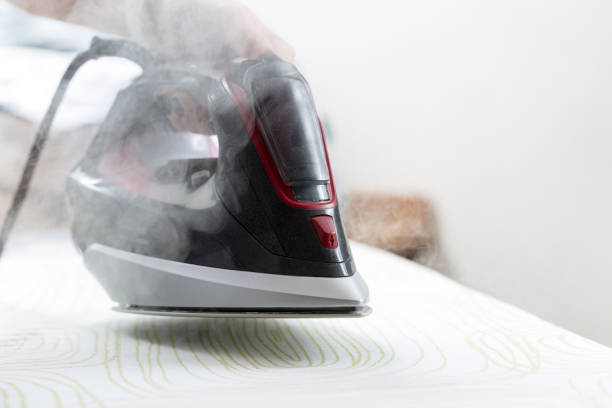 istock Woman uses irons, ironing at home. 650966374