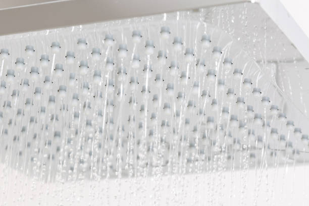 istock head shower and falling water in the shower 650968248