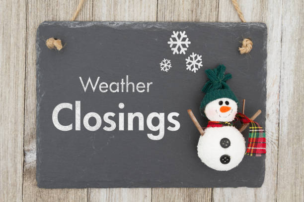 Weather closing sign Weather closing sign, A chalkboard sign with a snowman with text Weather Closing on weathered wood closing photos stock pictures, royalty-free photos & images