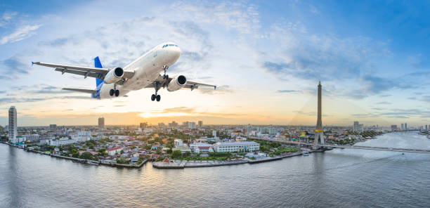 istock Airplane take off over the panorama city at twilight scene 651005404