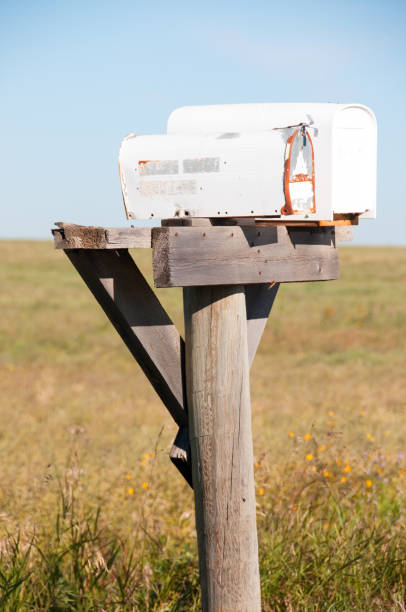 istock Vintage metal rural mailbox on field edge in autumn 651009658