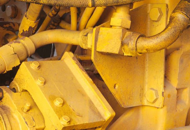 yellow motor engine machine excavator hydraulic tractor vehicle closeup
