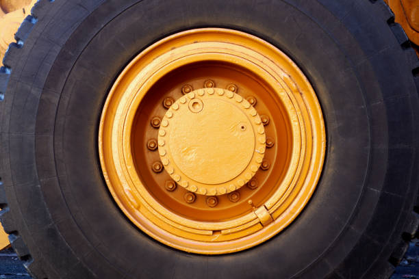 big wheel excavator tractor black rubber tire yellow painted circle