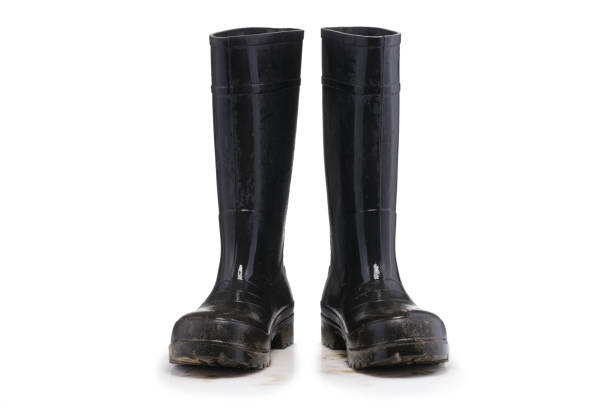 istock Wet dirty Mud boots isolated on pure white background 651066868
