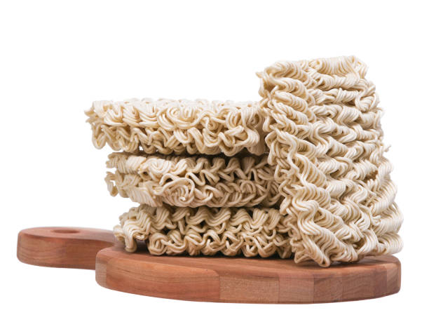 istock Ramen instant raw noodles on wooden plank 3/4 651079454