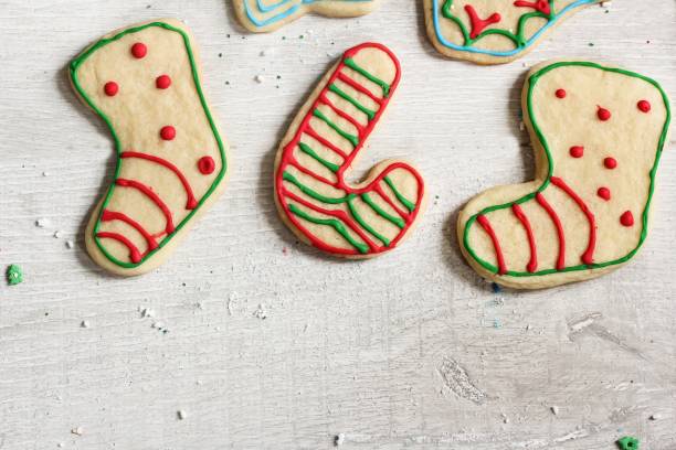 istock Xmas cut out sugar cookies decorated by kids 651083792