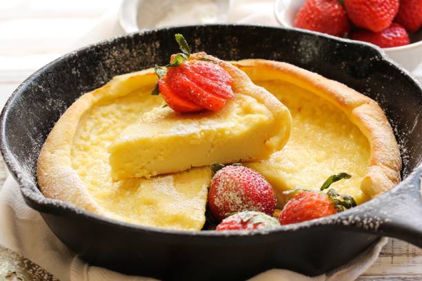 istock Dutch baby Puffed Pancake baked in cast iron skillet, selective focus 651110110