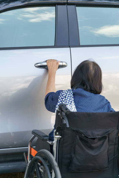 istock Elderly woman open door car 651138818