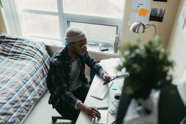 African american man working in his bedroom office