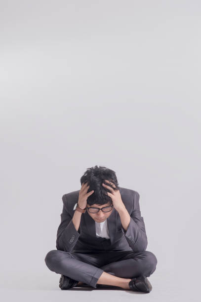 istock Businessman in suit Headache because of stress 651160404