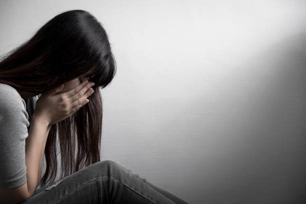 istock depression woman sit on floor 651169154