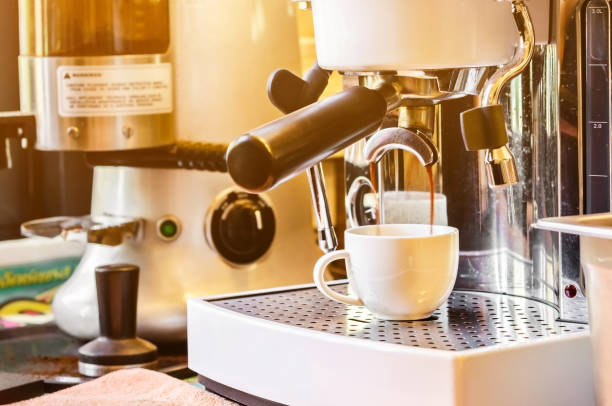 istock spresso pouring from coffee machin 651173058