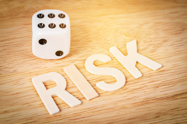 istock Dice and risk word wooden 651176636