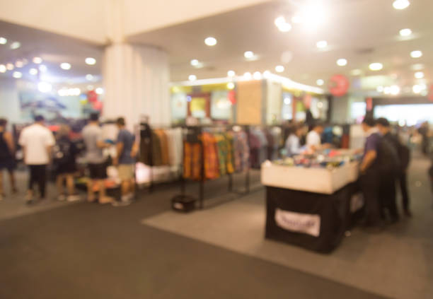 istock Abstract blurred event with people in shopping mall for background 651183824