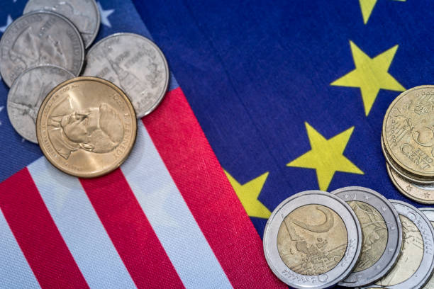 istock European and American flag with coins. 651187144