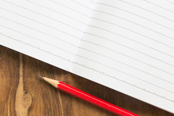 istock Blank notebook with pencil on wooden table, business concept 651187872