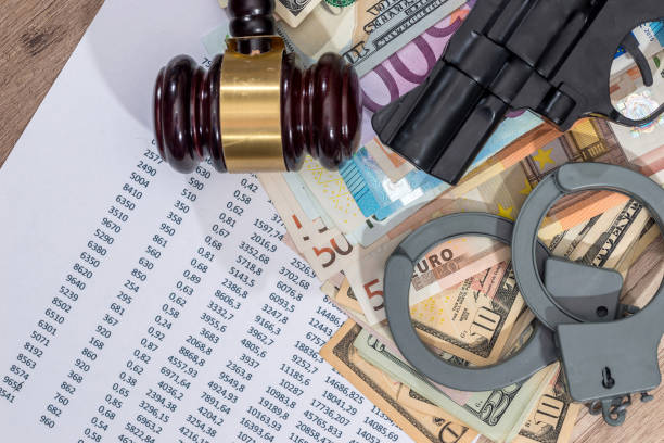 istock gun, hammer, handcuffs, euro, personal  budget and calculator. 651188616