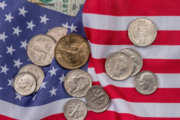 istock usa flag with dollar bills and coin. macro 651195790