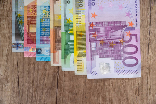 istock set of euro banknotes on wodden desk. 651199202