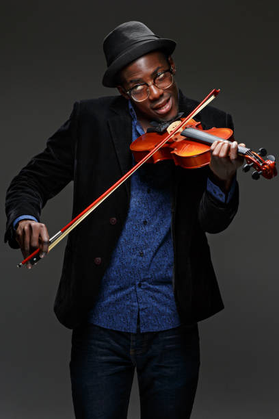 istock The black man happy expression and music instrument 651202740
