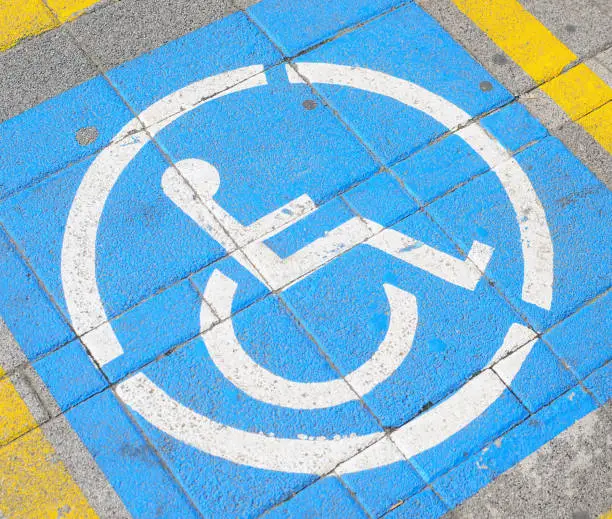 Parkingspace for disabled with wheelchair symbol on street floor