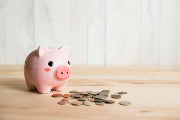istock Time is money, clock and coins on white background 651213448