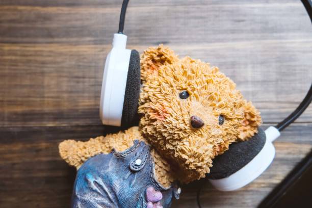 istock cute toy with headphone 651215118