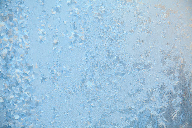 istock beautiful winter texture patterns of frost on window 651215314