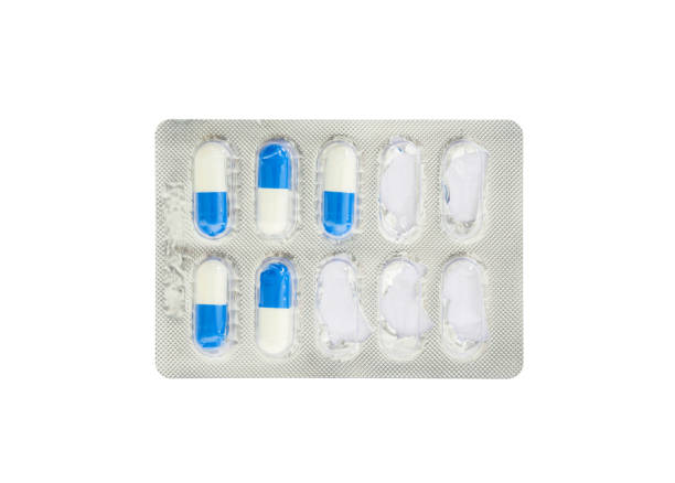 istock Closeup blue and white pills in blister pack isolated on white background with clipping path 651217890
