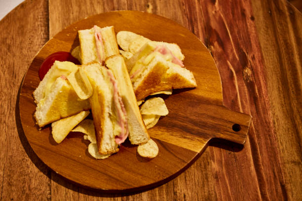 istock Sandwiches hamcheese on wooden table 651221360