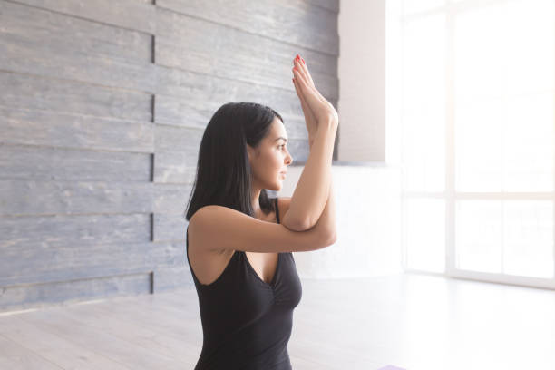istock Yoga girl on fitness class background practicing 651221768