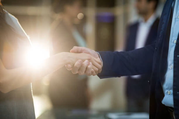 istock Businessman shaking hands with colleague 651222222