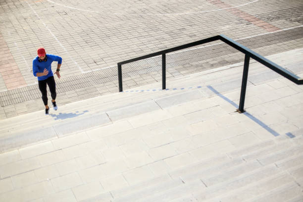 istock Young man exercising on stairs 651223642