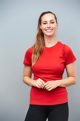 Happy athlete in red t-shirt, smiling