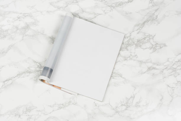 istock Mock-up magazines or catalog on white marble table background. 651233042