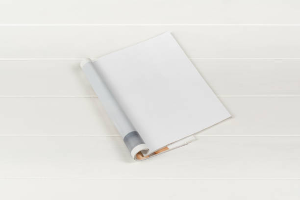 istock Mock-up magazines or catalog on white wooden table background. 651233124