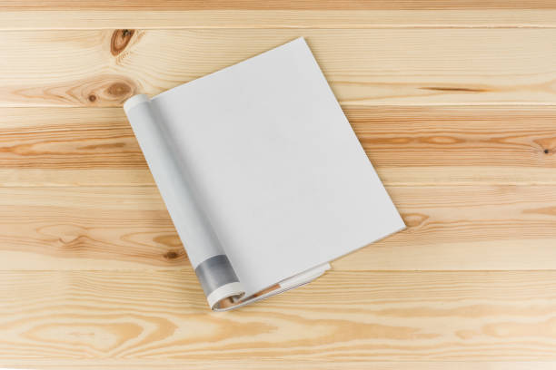 istock Mock-up magazines or catalog on natural wooden table background. 651233158