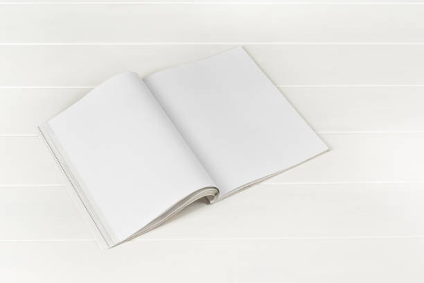istock Mock-up magazines or catalog on white wooden table background. 651233328